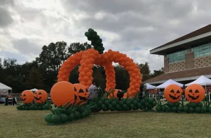 Large pumpkin balloon sculpture for a public seasonal event